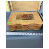 Wooden box with flower art on lid.