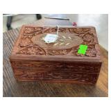 Wooden box with flower art on lid.