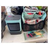 Travel case full of nail polish and tips, nippers, files and a dryer