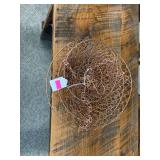 Copper colored metal hanging fruit basket