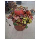 lot contains a decorative fall harvest-themed tabletop arrangement consisting of faux pumpkins, artificial leaves, fruit, and berries.