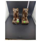 lot contains a pair of hand-carved wooden book end bear figurines,