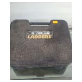 lot contains a Gorilla Ladders 4-in-1 Static Hinge Kit, a weightwatchers cook book and a portfolio of gold-etch prints by R.H. Palenske, metal shelf,  blue dufflebag with a foot pump.