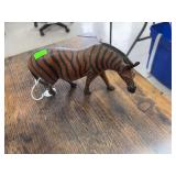 Wooden zebra statue.