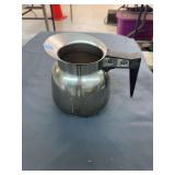 Metal carafe, small sifter, cookie cutters and a mini boot