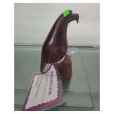 lot contains a hand carved eagle made from ironwood