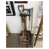3 scoop shovels, 2 weed cotters and a lawn aerator