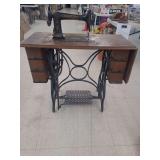 lot contains a vintage Standard Sewing Machine Co. sewing machine, manufactured in Cleveland, Ohio, which is considered a collectible item due to its age and historical design.