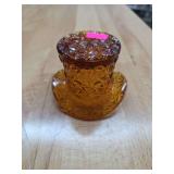 Orange glass hat decor.