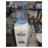 lot contains a whirlpool electric hot and cold 5gal water dispenser .