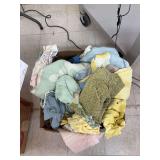 Box of baby doll clothes