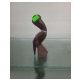 lot contains a hand carved pelican made from ironwood.  approx. 6 inches
