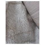 lot contains a 7 by 10 foot bazaar holmmby diamond  shaggy area rug.