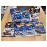 7 hot wheels cars in packages.