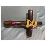 Wooden cross with rope