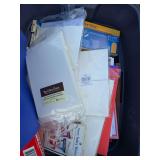 Tote of office supplies