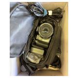 Box with cameras and bag straps