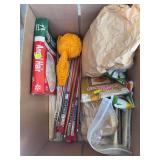Box with crochet needles and other craft accessories