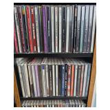 2 cds racks filled with misc cds aprox 500