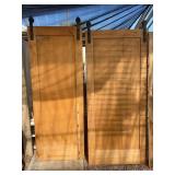 Two solid wood barn doors meant to be on a double rail to overlap each other. Solid wood