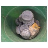 Bucket of lead scraps.