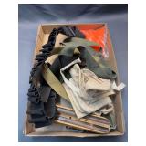 Box of gunslings and ammo belts
