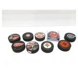 NHL HOCKEY PUCKS-- MAINLY RED WINGS