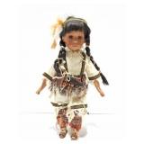 NATIVE AMERICAN PORCELAIN DOLL ON STAND