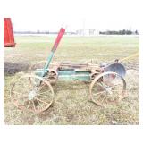 CHOP SAWWITH RUNNING GEAR AND A WOODEN RUNNING