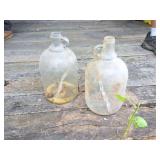 2 VINTAGE GLASS MOONSHINE JUGS