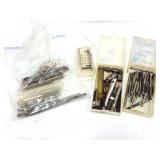 Assorted mechanical tools, drill bits, taps