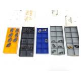Assorted indexable carbide cutting inserts