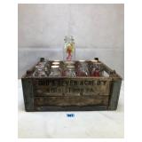 Antique milk crate and glass milk bottles