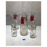 Various antique glass milk bottles