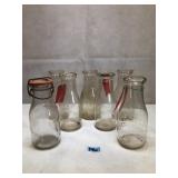 Various antique glass milk bottles