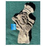 Primitive carved stone figure