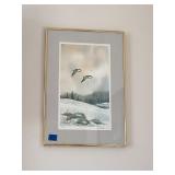 Pair of framed winter themed prints