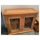 Wooden cabinet with glass doors