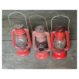 Three Vintage Red Kerosene Lanterns