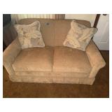 Upholstered Tan Loveseat with Accent Pillows