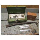 crowbar,sawzall blades,wood box,brass items