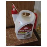 half full jug of home defense & partial round up