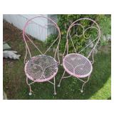 2 pink metal chairs