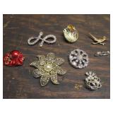 8 brooches