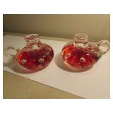 2 matching joe st.clair candleholder paperweights