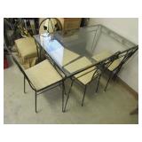 old metal patio table w/4 chairs