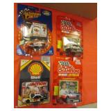4 toy nascars in packages