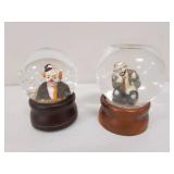 2 clown snow globes
