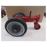 red metal art tractor