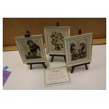 3 MJ Hummel porcelain artwork on easels